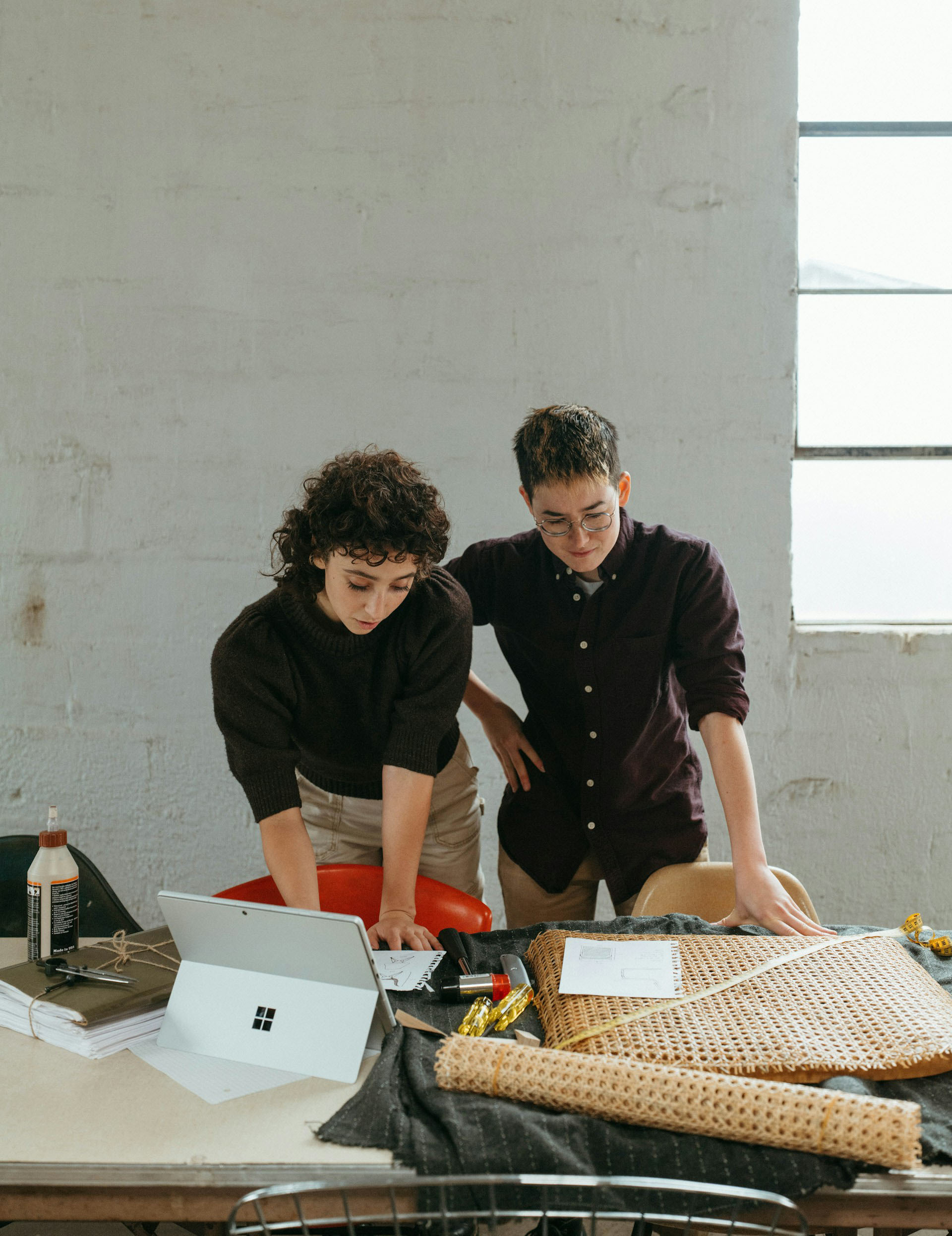 Two people working together at a computer